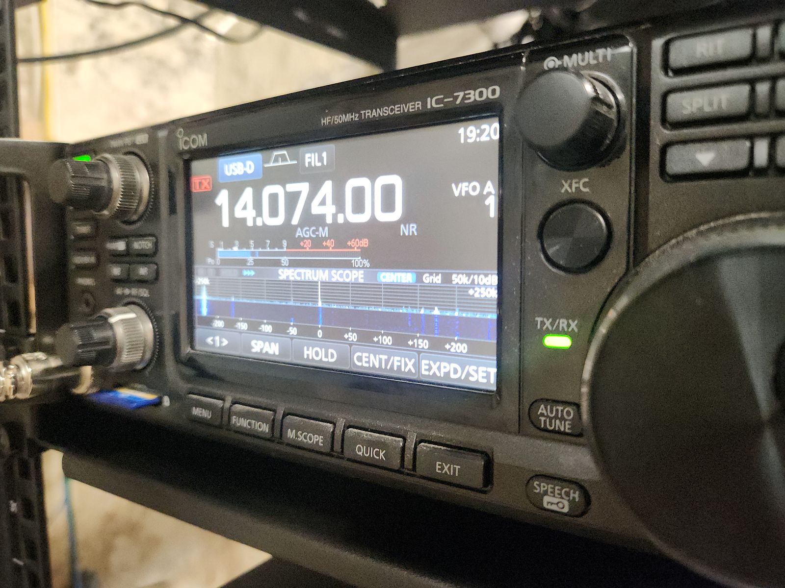HF transceiver tuned to 14.074 MHz with stations visible on its spectrum scope